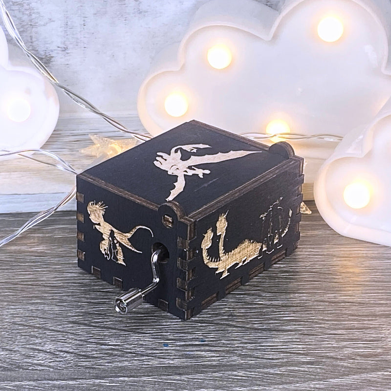 Load image into Gallery viewer, Looking for a gift for a How to Train Your Dragon fan? MarketPlacefad offers unique wooden music boxes that combine art and music perfectly. Each box produces a beautiful melody that will transport you to a world of pure delight.
