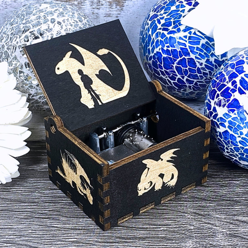 Load image into Gallery viewer, Looking for a gift for a How to Train Your Dragon fan? MarketPlacefad offers unique wooden music boxes that combine art and music perfectly. Each box produces a beautiful melody that will transport you to a world of pure delight.
