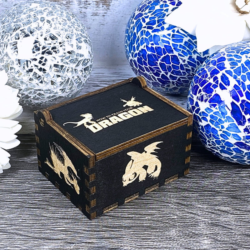 Load image into Gallery viewer, Looking for a gift for a How to Train Your Dragon fan? MarketPlacefad offers unique wooden music boxes that combine art and music perfectly. Each box produces a beautiful melody that will transport you to a world of pure delight.
