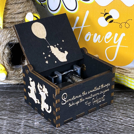 Embark on an adventure with classic Winnie-the-Pooh characters - Christopher Robin, Tigger, Piglet, Roo, and Eeyore - this exceptional music box lets you share these beautiful qualities with your loved one, buy one today!