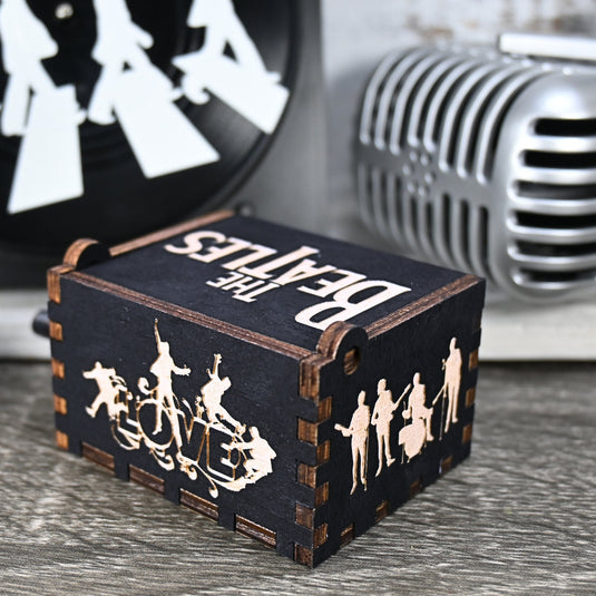 Immerse yourself in the classics of The Beatles as you listen to their legendary songs and lyrics emanating from the finely tuned wooden box. Each music box is a testament to the artistry and attention to detail, making it a perfect gift for anyone!