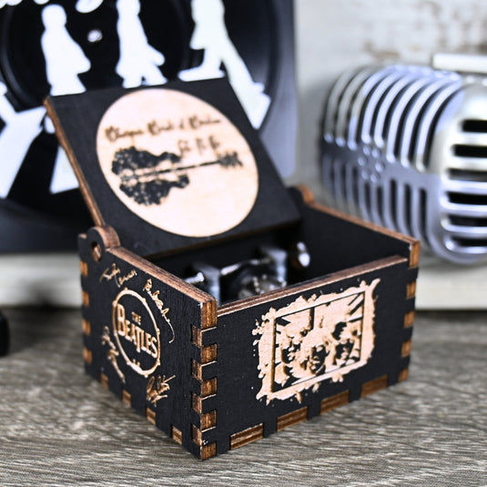 Immerse yourself in the classics of The Beatles as you listen to their legendary songs and lyrics emanating from the finely tuned wooden box. Each music box is a testament to the artistry and attention to detail, making it a perfect gift for anyone!