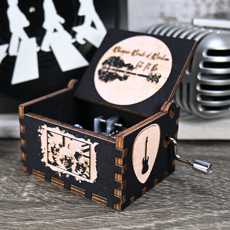 Load image into Gallery viewer, Immerse yourself in the classics of The Beatles as you listen to their legendary songs and lyrics emanating from the finely tuned wooden box. Each music box is a testament to the artistry and attention to detail, making it a perfect gift for anyone!
