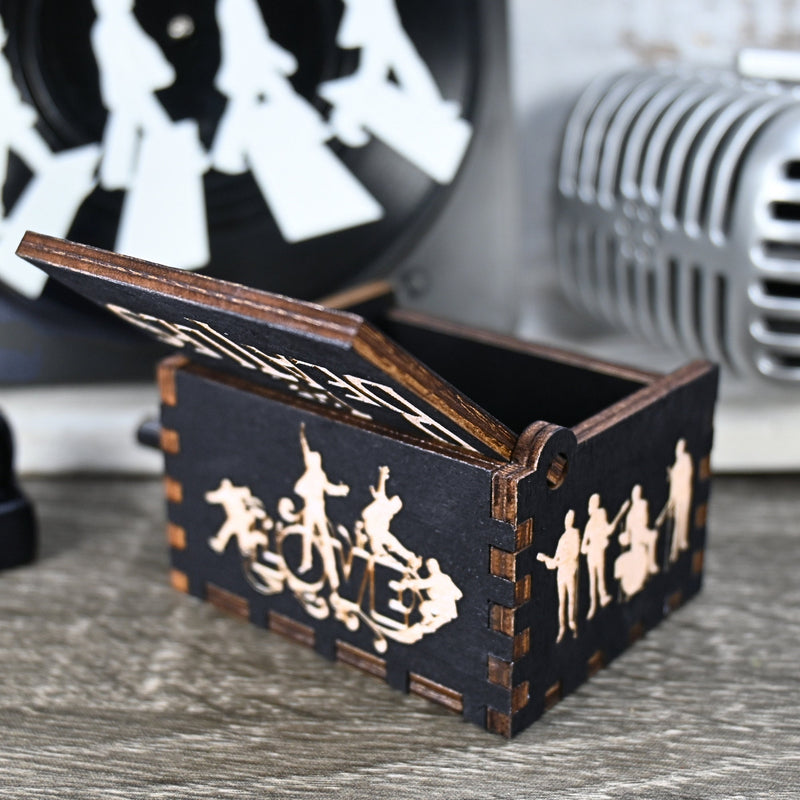 Load image into Gallery viewer, Immerse yourself in the classics of The Beatles as you listen to their legendary songs and lyrics emanating from the finely tuned wooden box. Each music box is a testament to the artistry and attention to detail, making it a perfect gift for anyone!
