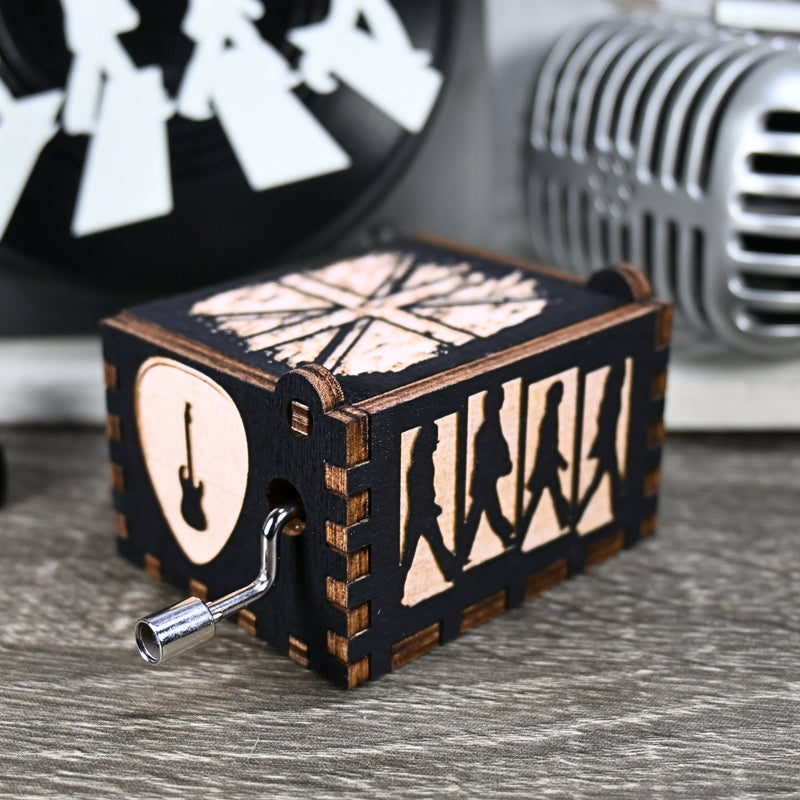 Load image into Gallery viewer, Immerse yourself in the classics of The Beatles as you listen to their legendary songs and lyrics emanating from the finely tuned wooden box. Each music box is a testament to the artistry and attention to detail, making it a perfect gift for anyone!
