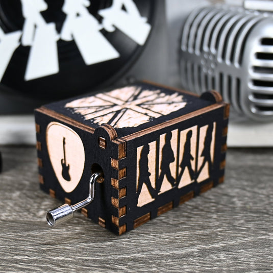 Immerse yourself in the classics of The Beatles as you listen to their legendary songs and lyrics emanating from the finely tuned wooden box. Each music box is a testament to the artistry and attention to detail, making it a perfect gift for anyone!