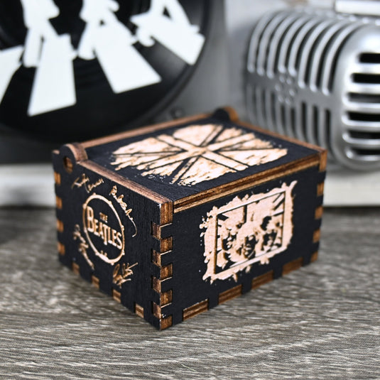 Immerse yourself in the classics of The Beatles as you listen to their legendary songs and lyrics emanating from the finely tuned wooden box. Each music box is a testament to the artistry and attention to detail, making it a perfect gift for anyone!