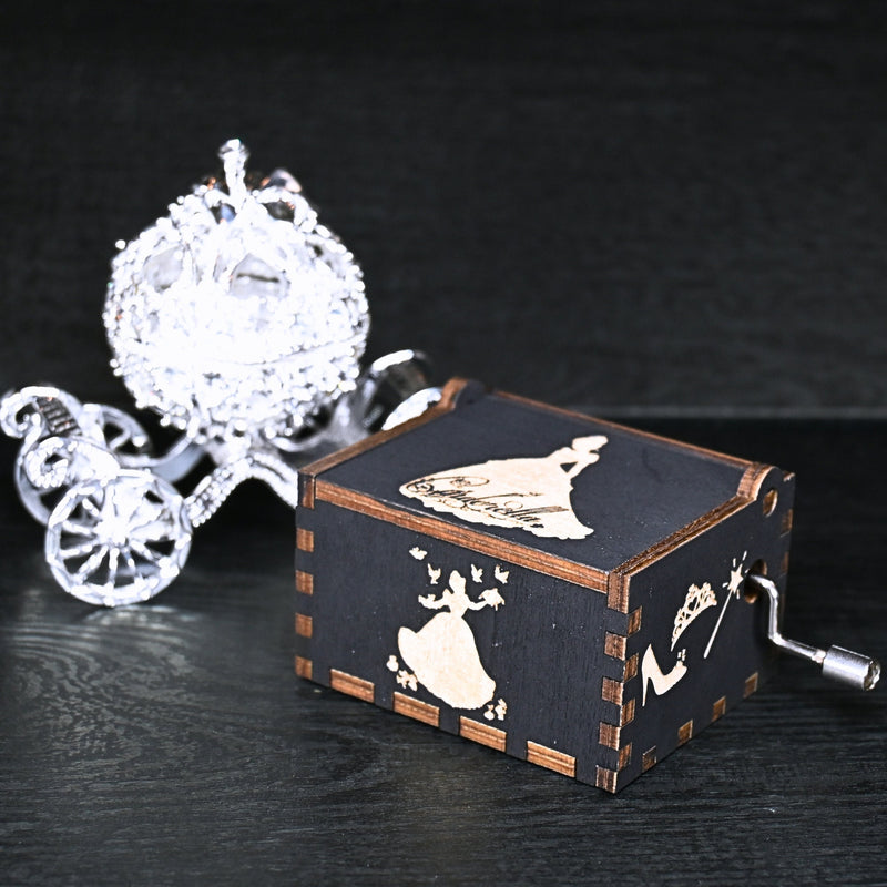 Load image into Gallery viewer, Experience the enchanting world of Cinderella with a music box that captures the tale in all its glory. As you turn the key, the sweet melody fills the air. This music box is a delightful treat for yourself or a loved one.
