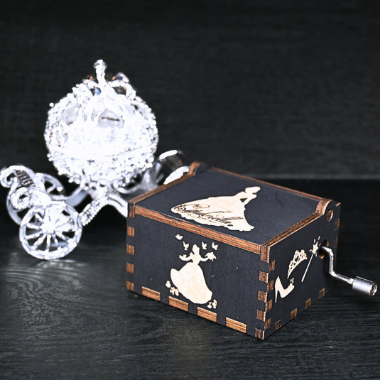 Experience the enchanting world of Cinderella with a music box that captures the tale in all its glory. As you turn the key, the sweet melody fills the air. This music box is a delightful treat for yourself or a loved one.