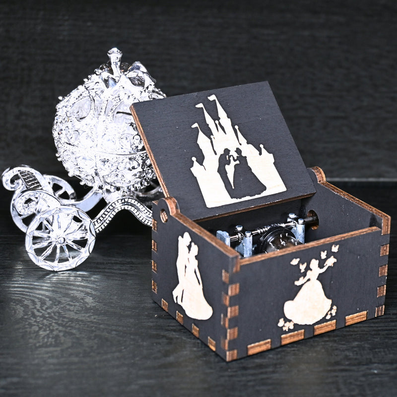 Load image into Gallery viewer, Experience the enchanting world of Cinderella with a music box that captures the tale in all its glory. As you turn the key, the sweet melody fills the air. This music box is a delightful treat for yourself or a loved one.
