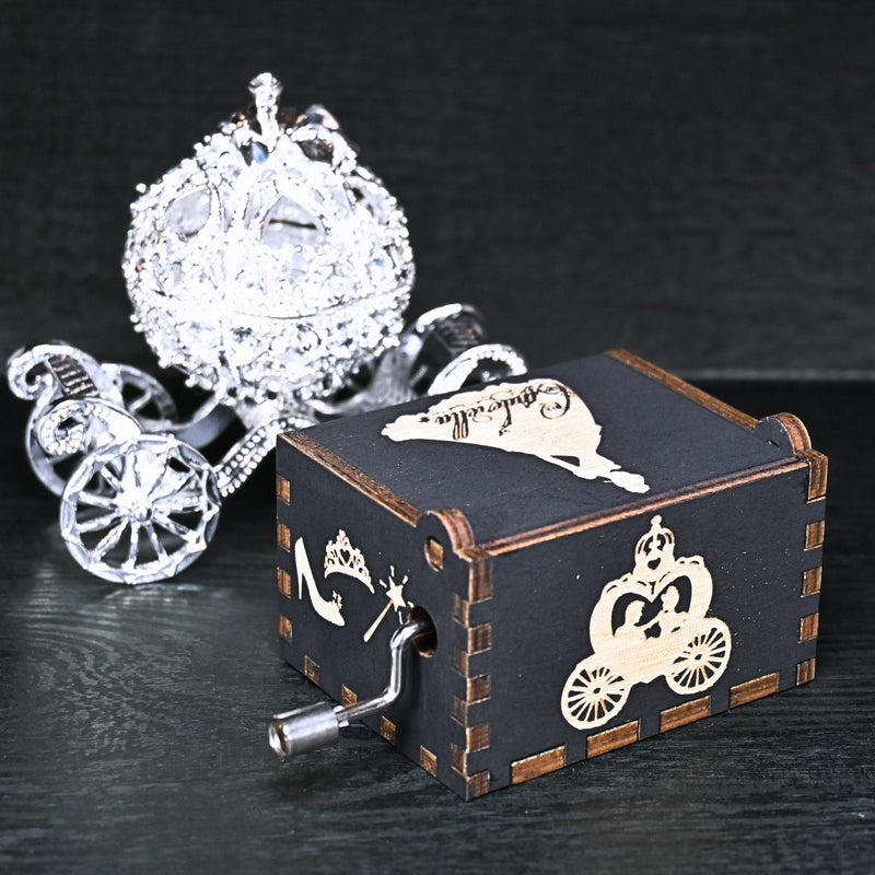 Load image into Gallery viewer, Experience the enchanting world of Cinderella with a music box that captures the tale in all its glory. As you turn the key, the sweet melody fills the air. This music box is a delightful treat for yourself or a loved one.
