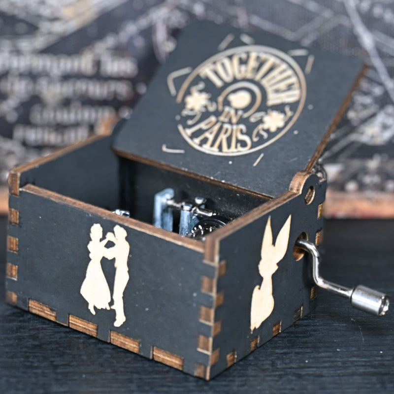 Load image into Gallery viewer, Crafted with intricate details and designed to delight the senses, this music box is a tribute to the classic tale; its tune of Once Upon a December is the perfect way to relive the memories of the beloved characters and their timeless story.
