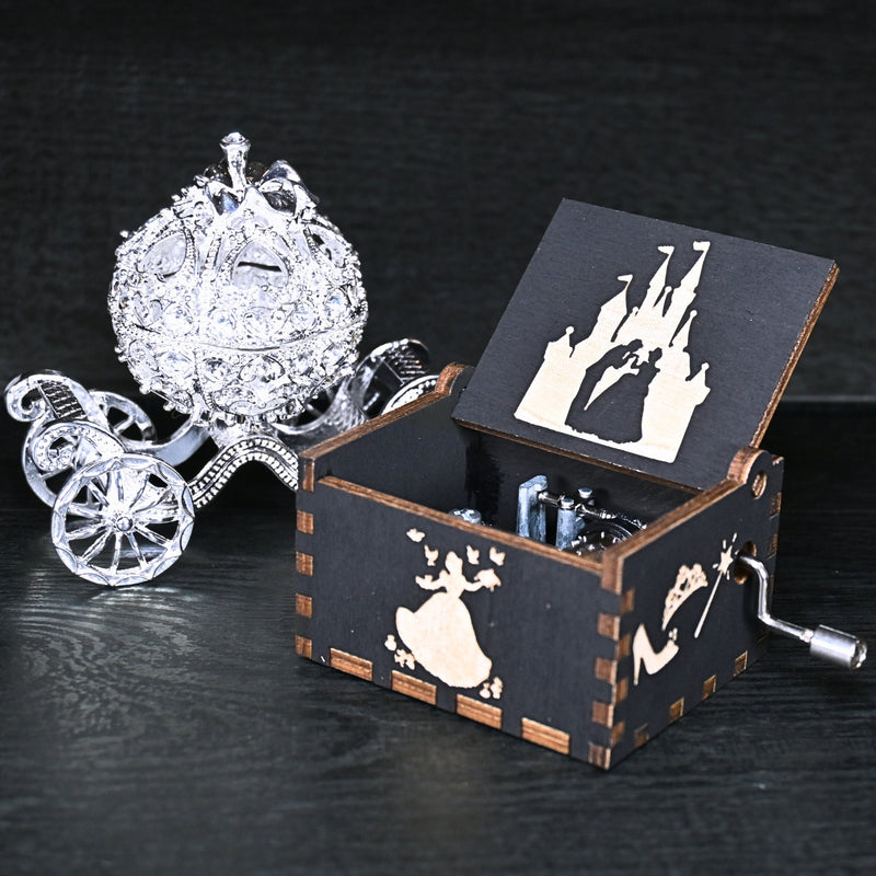 Load image into Gallery viewer, Experience the enchanting world of Cinderella with a music box that captures the tale in all its glory. As you turn the key, the sweet melody fills the air. This music box is a delightful treat for yourself or a loved one.
