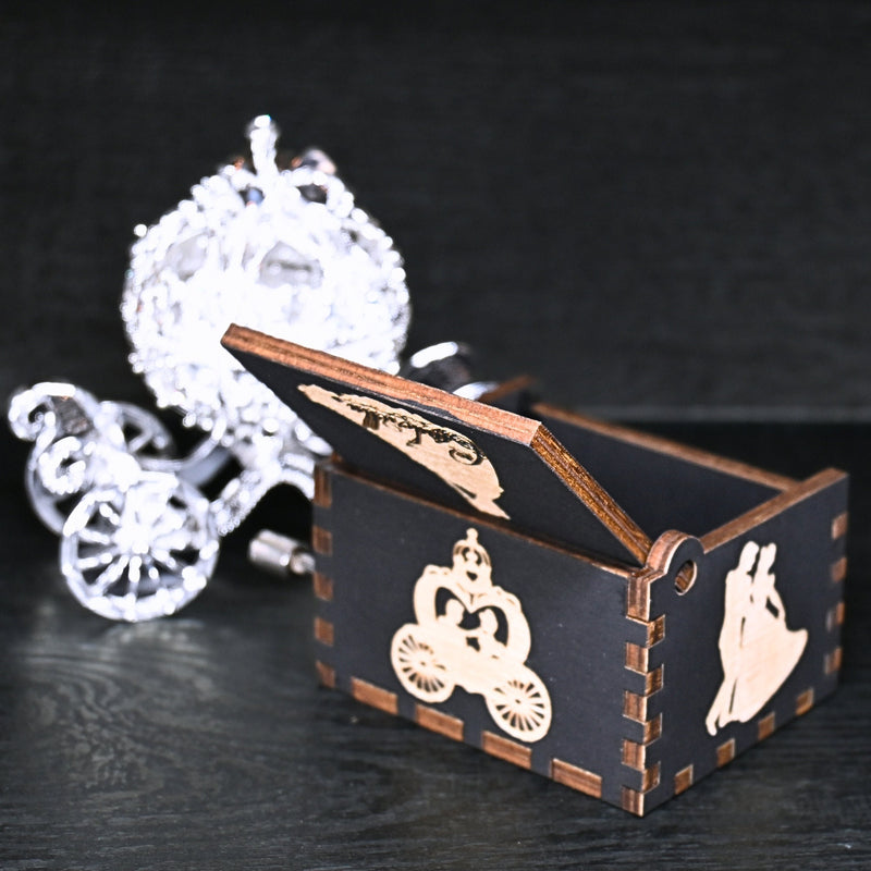 Load image into Gallery viewer, Experience the enchanting world of Cinderella with a music box that captures the tale in all its glory. As you turn the key, the sweet melody fills the air. This music box is a delightful treat for yourself or a loved one.
