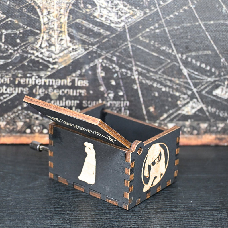 Load image into Gallery viewer, Crafted with intricate details and designed to delight the senses, this music box is a tribute to the classic tale; its tune of Once Upon a December is the perfect way to relive the memories of the beloved characters and their timeless story.
