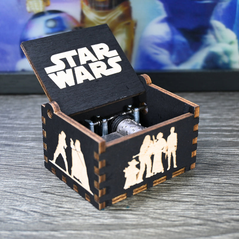 Load image into Gallery viewer, Are you a devoted follower of the Star Wars franchise? If so, you&#39;ll be thrilled to experience the excitement and adventure of your favorite movies in a whole new dimension with this exquisite music box. The box is masterfully handcrafted.
