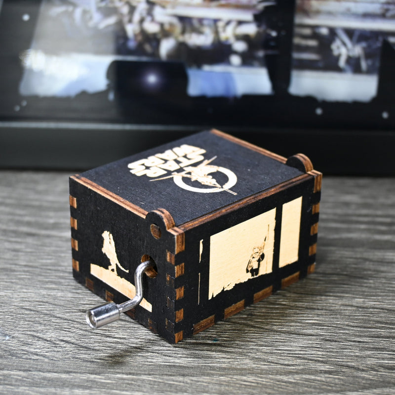 Load image into Gallery viewer, Are you a devoted follower of the Star Wars franchise? If so, you&#39;ll be thrilled to experience the excitement and adventure of your favorite movies in a whole new dimension with this exquisite music box. The box is masterfully handcrafted.
