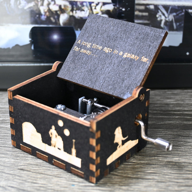 Load image into Gallery viewer, Are you a devoted follower of the Star Wars franchise? If so, you&#39;ll be thrilled to experience the excitement and adventure of your favorite movies in a whole new dimension with this exquisite music box. The box is masterfully handcrafted.
