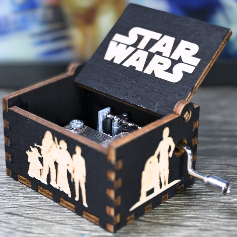 Load image into Gallery viewer, Are you a devoted follower of the Star Wars franchise? If so, you&#39;ll be thrilled to experience the excitement and adventure of your favorite movies in a whole new dimension with this exquisite music box. The box is masterfully handcrafted.
