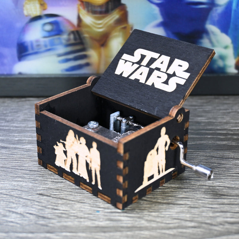 Load image into Gallery viewer, Are you a devoted follower of the Star Wars franchise? If so, you&#39;ll be thrilled to experience the excitement and adventure of your favorite movies in a whole new dimension with this exquisite music box. The box is masterfully handcrafted.
