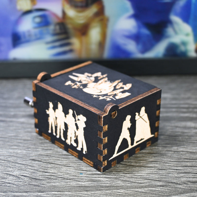 Load image into Gallery viewer, Are you a devoted follower of the Star Wars franchise? If so, you&#39;ll be thrilled to experience the excitement and adventure of your favorite movies in a whole new dimension with this exquisite music box. The box is masterfully handcrafted.
