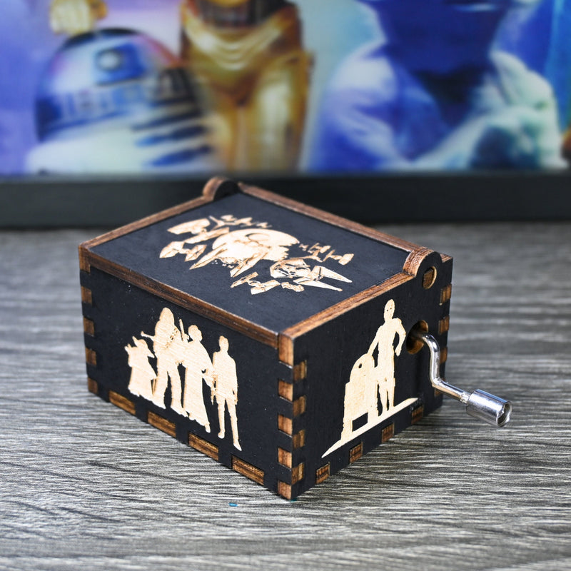 Load image into Gallery viewer, Are you a devoted follower of the Star Wars franchise? If so, you&#39;ll be thrilled to experience the excitement and adventure of your favorite movies in a whole new dimension with this exquisite music box. The box is masterfully handcrafted.
