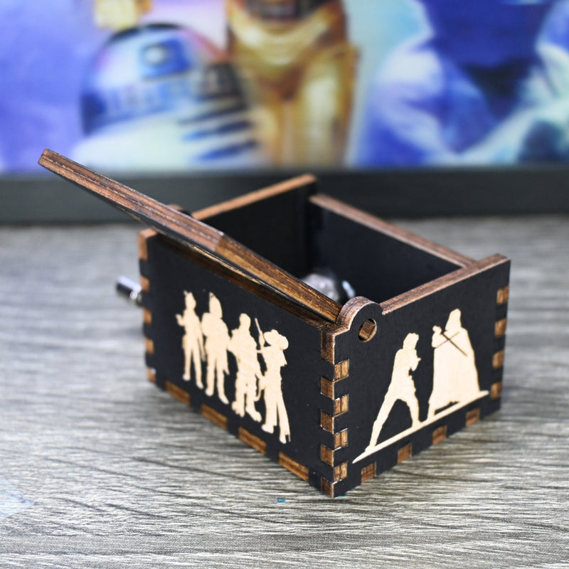 Load image into Gallery viewer, Are you a devoted follower of the Star Wars franchise? If so, you&#39;ll be thrilled to experience the excitement and adventure of your favorite movies in a whole new dimension with this exquisite music box. The box is masterfully handcrafted.
