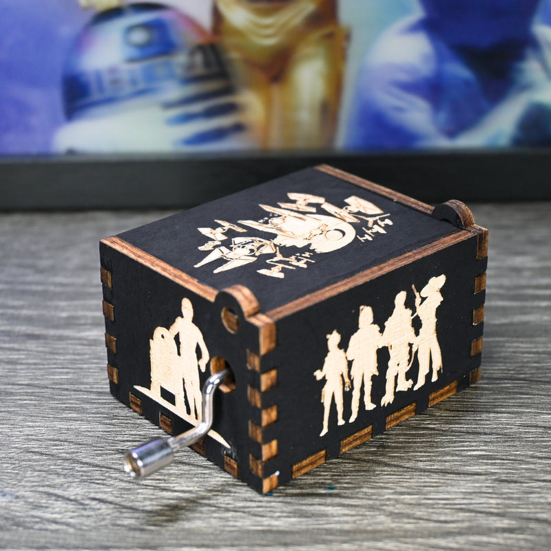 Load image into Gallery viewer, Are you a devoted follower of the Star Wars franchise? If so, you&#39;ll be thrilled to experience the excitement and adventure of your favorite movies in a whole new dimension with this exquisite music box. The box is masterfully handcrafted.
