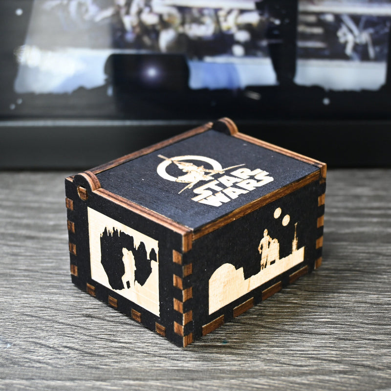 Load image into Gallery viewer, Are you a devoted follower of the Star Wars franchise? If so, you&#39;ll be thrilled to experience the excitement and adventure of your favorite movies in a whole new dimension with this exquisite music box. The box is masterfully handcrafted.
