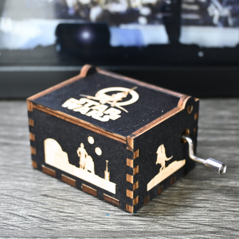 Load image into Gallery viewer, Are you a devoted follower of the Star Wars franchise? If so, you&#39;ll be thrilled to experience the excitement and adventure of your favorite movies in a whole new dimension with this exquisite music box. The box is masterfully handcrafted.
