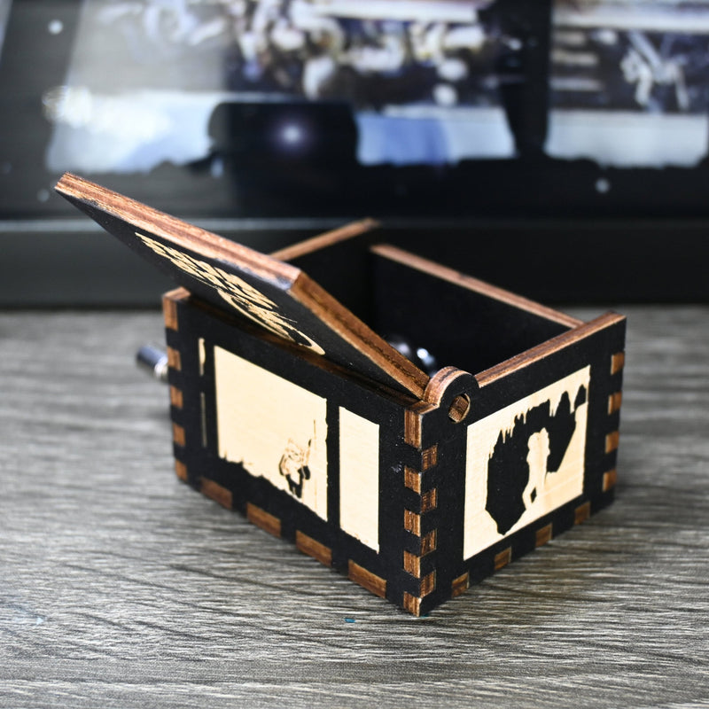 Load image into Gallery viewer, Are you a devoted follower of the Star Wars franchise? If so, you&#39;ll be thrilled to experience the excitement and adventure of your favorite movies in a whole new dimension with this exquisite music box. The box is masterfully handcrafted.
