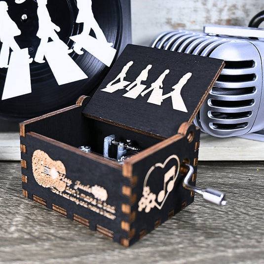 Immerse yourself in the classics of The Beatles as you listen to their legendary songs and lyrics emanating from the finely tuned wooden box. Each music box is a testament to the artistry and attention to detail, making it a perfect gift for anyone!