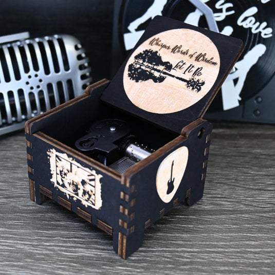 Immerse yourself in the classics of The Beatles as you listen to their legendary songs and lyrics emanating from the finely tuned wooden box. Each music box is a testament to the artistry and attention to detail, making it a perfect gift for anyone!