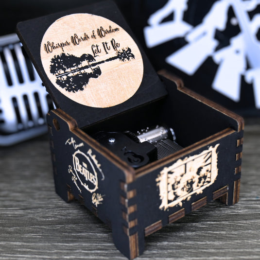 Immerse yourself in the classics of The Beatles as you listen to their legendary songs and lyrics emanating from the finely tuned wooden box. Each music box is a testament to the artistry and attention to detail, making it a perfect gift for anyone!