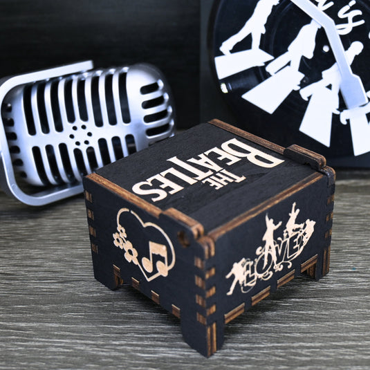 Immerse yourself in the classics of The Beatles as you listen to their legendary songs and lyrics emanating from the finely tuned wooden box. Each music box is a testament to the artistry and attention to detail, making it a perfect gift for anyone!