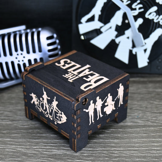 Immerse yourself in the classics of The Beatles as you listen to their legendary songs and lyrics emanating from the finely tuned wooden box. Each music box is a testament to the artistry and attention to detail, making it a perfect gift for anyone!