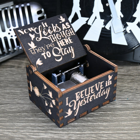 Immerse yourself in the classics of The Beatles as you listen to their legendary songs and lyrics emanating from the finely tuned wooden box. Each music box is a testament to the artistry and attention to detail, making it a perfect gift for anyone!