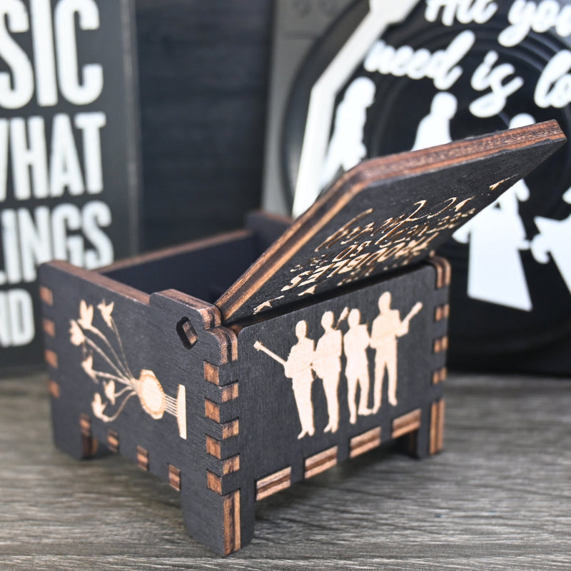 Load image into Gallery viewer, Immerse yourself in the classics of The Beatles as you listen to their legendary songs and lyrics emanating from the finely tuned wooden box. Each music box is a testament to the artistry and attention to detail, making it a perfect gift for anyone!
