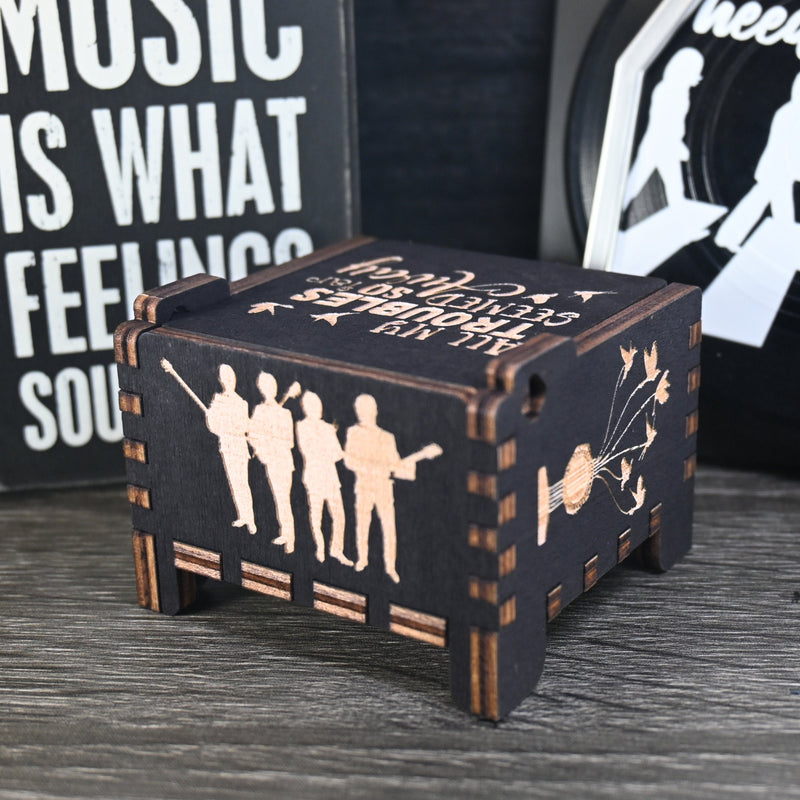 Load image into Gallery viewer, Immerse yourself in the classics of The Beatles as you listen to their legendary songs and lyrics emanating from the finely tuned wooden box. Each music box is a testament to the artistry and attention to detail, making it a perfect gift for anyone!
