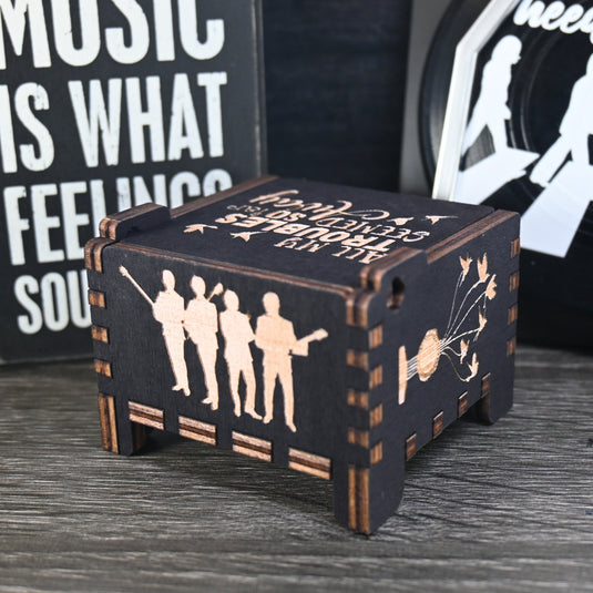 Immerse yourself in the classics of The Beatles as you listen to their legendary songs and lyrics emanating from the finely tuned wooden box. Each music box is a testament to the artistry and attention to detail, making it a perfect gift for anyone!