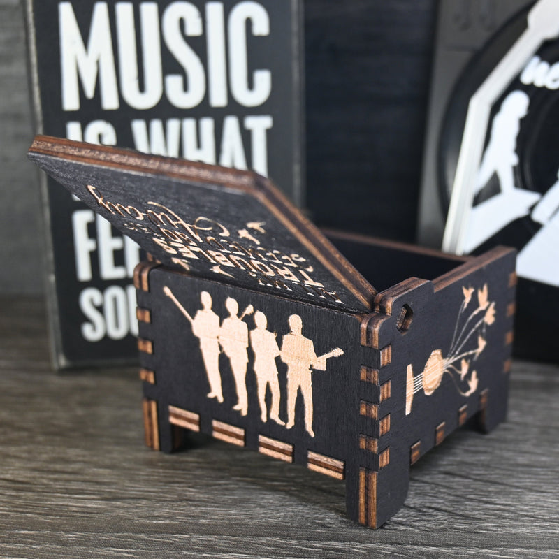 Load image into Gallery viewer, Immerse yourself in the classics of The Beatles as you listen to their legendary songs and lyrics emanating from the finely tuned wooden box. Each music box is a testament to the artistry and attention to detail, making it a perfect gift for anyone!
