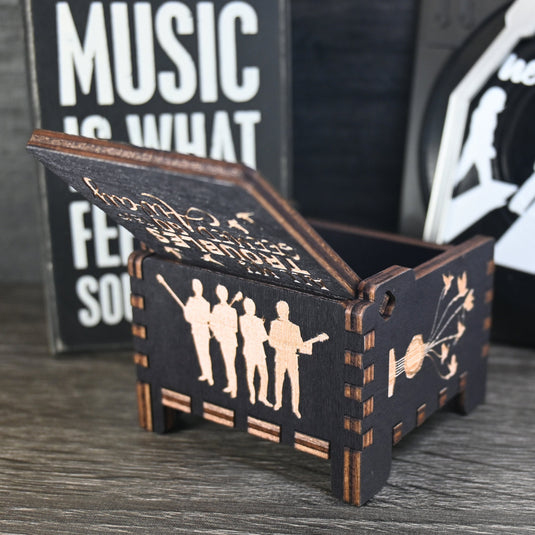 Immerse yourself in the classics of The Beatles as you listen to their legendary songs and lyrics emanating from the finely tuned wooden box. Each music box is a testament to the artistry and attention to detail, making it a perfect gift for anyone!