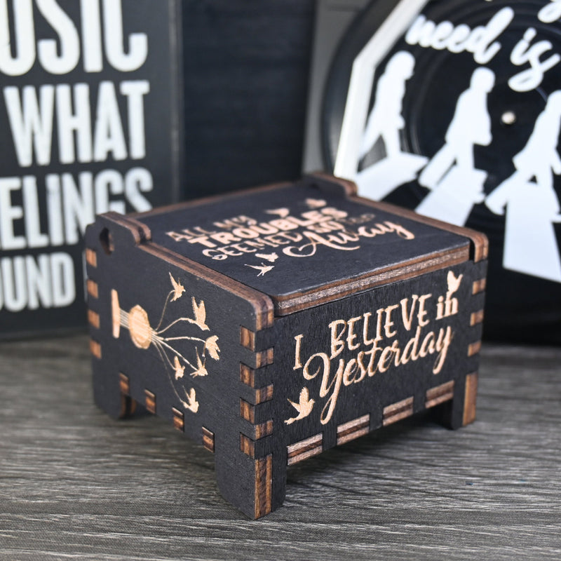 Load image into Gallery viewer, Immerse yourself in the classics of The Beatles as you listen to their legendary songs and lyrics emanating from the finely tuned wooden box. Each music box is a testament to the artistry and attention to detail, making it a perfect gift for anyone!
