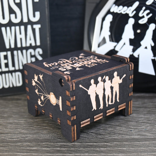 Immerse yourself in the classics of The Beatles as you listen to their legendary songs and lyrics emanating from the finely tuned wooden box. Each music box is a testament to the artistry and attention to detail, making it a perfect gift for anyone!