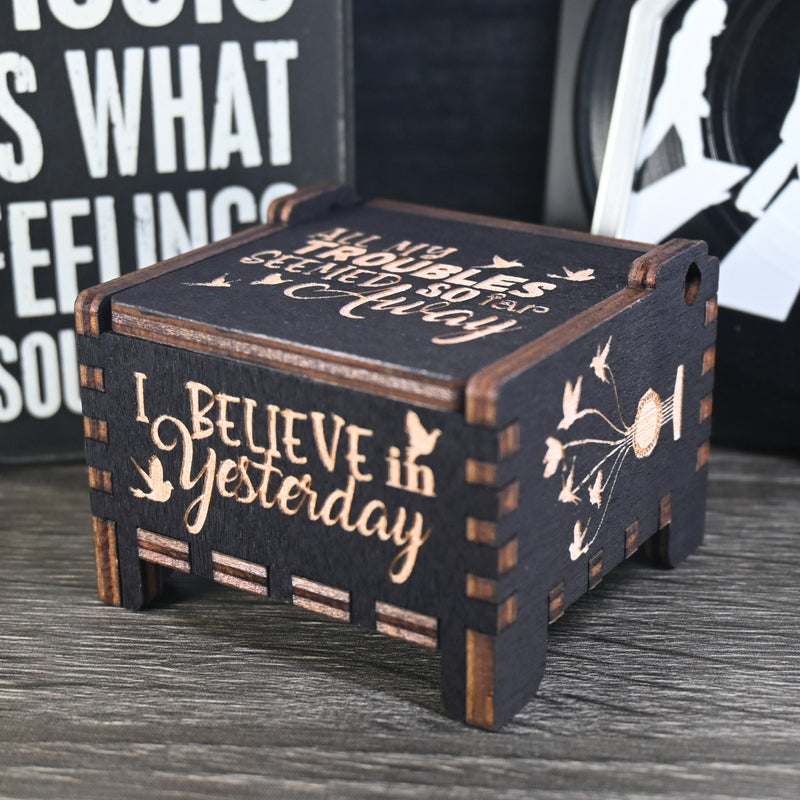 Load image into Gallery viewer, Immerse yourself in the classics of The Beatles as you listen to their legendary songs and lyrics emanating from the finely tuned wooden box. Each music box is a testament to the artistry and attention to detail, making it a perfect gift for anyone!
