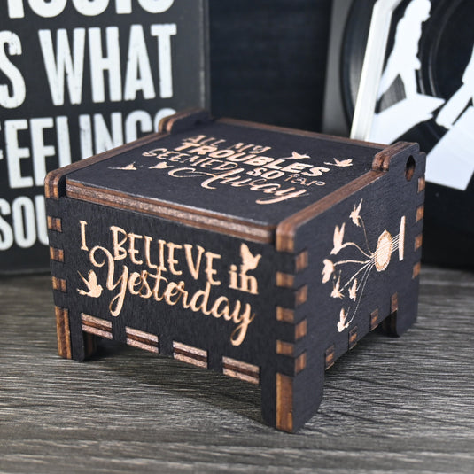 Immerse yourself in the classics of The Beatles as you listen to their legendary songs and lyrics emanating from the finely tuned wooden box. Each music box is a testament to the artistry and attention to detail, making it a perfect gift for anyone!