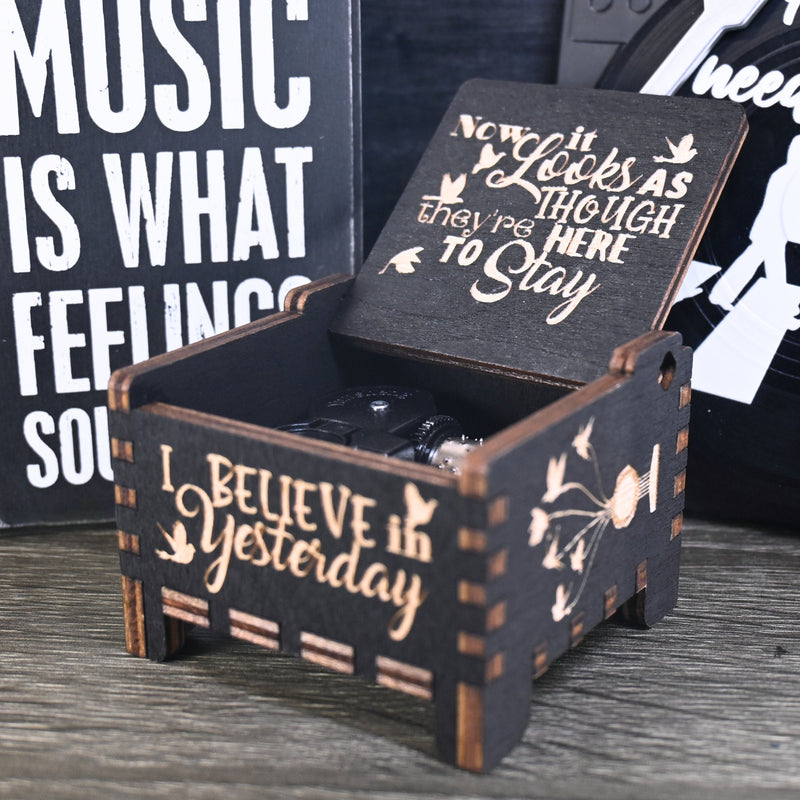 Load image into Gallery viewer, Immerse yourself in the classics of The Beatles as you listen to their legendary songs and lyrics emanating from the finely tuned wooden box. Each music box is a testament to the artistry and attention to detail, making it a perfect gift for anyone!
